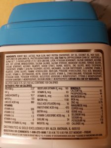 Nutritional information and ingredients label on a can of infant formula, indicating it's a formula milk intended to be the best for infant development.