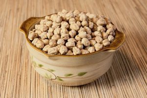 chickpeas in an air fryer - a bowl placed on the kitchen table 