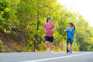 Exercise Scooters: Mom using exercise scooter