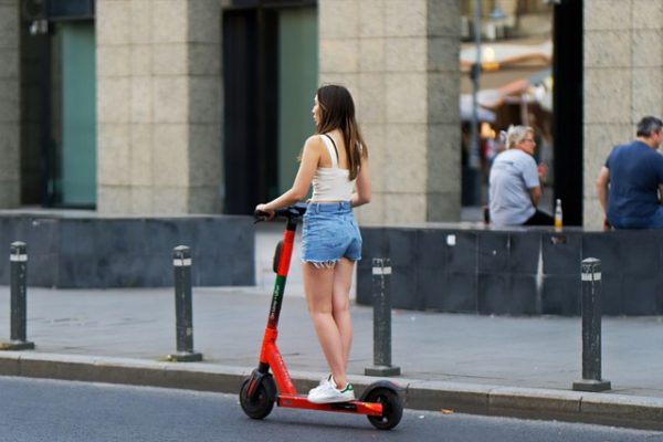 Scooter for teens - A girl strolling through the streets