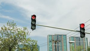 Red light indicating a stop, highlighting the importance of obeying signals for safety in urban environments.