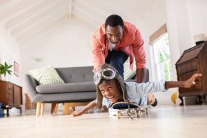 A skateboarder enjoying skateboard with son 