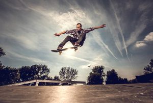 A skateboarder and his board.