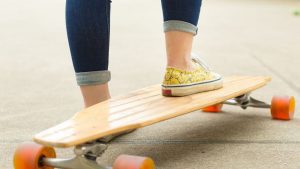 An electric skateboard poised for an exhilarating ride. The electric skateboards provide a smooth travel. Long-range electric skateboard