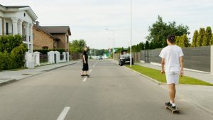 teenagers skateboarding outdoors